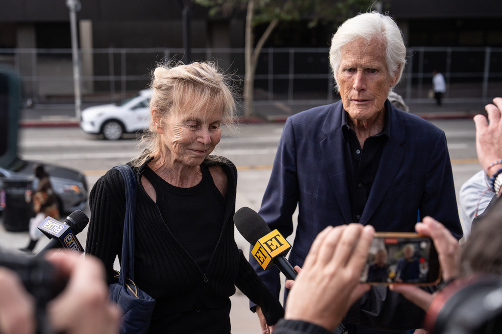 Matthew Perry's mother, Suzanne Morrison, left, and Keith Morrison, arrive at federal court for the sentencing of Kenneth Iwamasa, one of five people who pleaded guilty in connection with the ketamine overdose death of the actor, in Los Angeles, Wednesday, May 27, 2026. (AP Photo/Jae C. Hong)