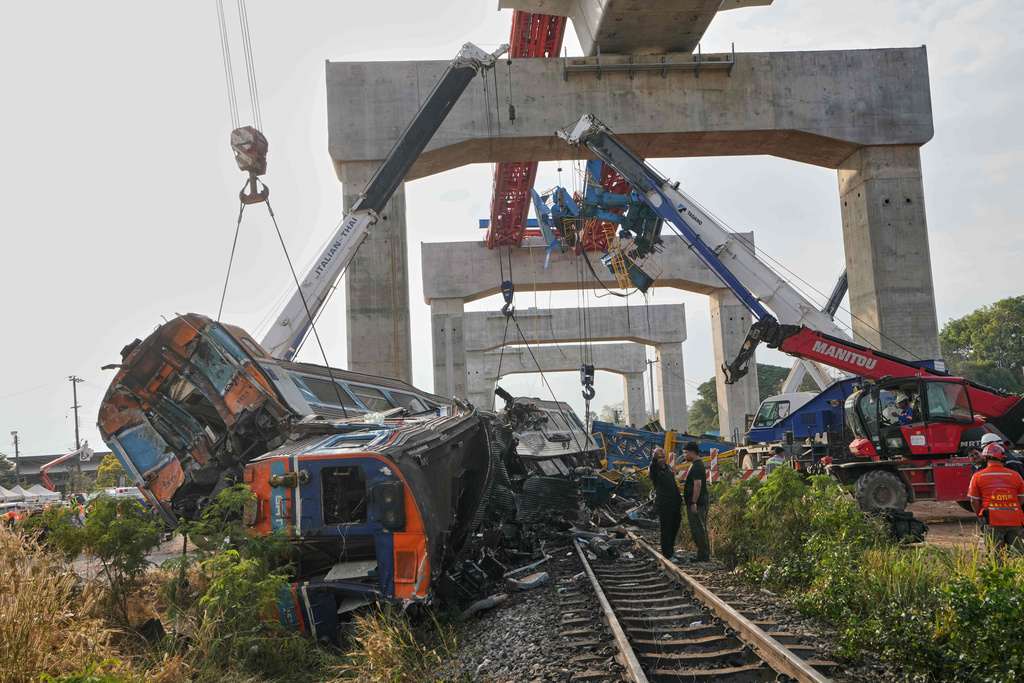 The wreckage after a construction crane fell into a passenger train in Nakhon Ratchasima province, Thailand, Wednesday, Jan.14, 2026. (AP Photo/Sakchai Lalit))