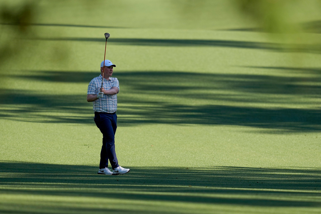 Robert MacIntyre, of Scotland, hits from the fairway on the 13th hole during the first round of the Masters golf tournament at the Augusta National Golf Club, Thursday, April 9, 2026, in Augusta, Ga. (AP Photo/David J. Phillip)