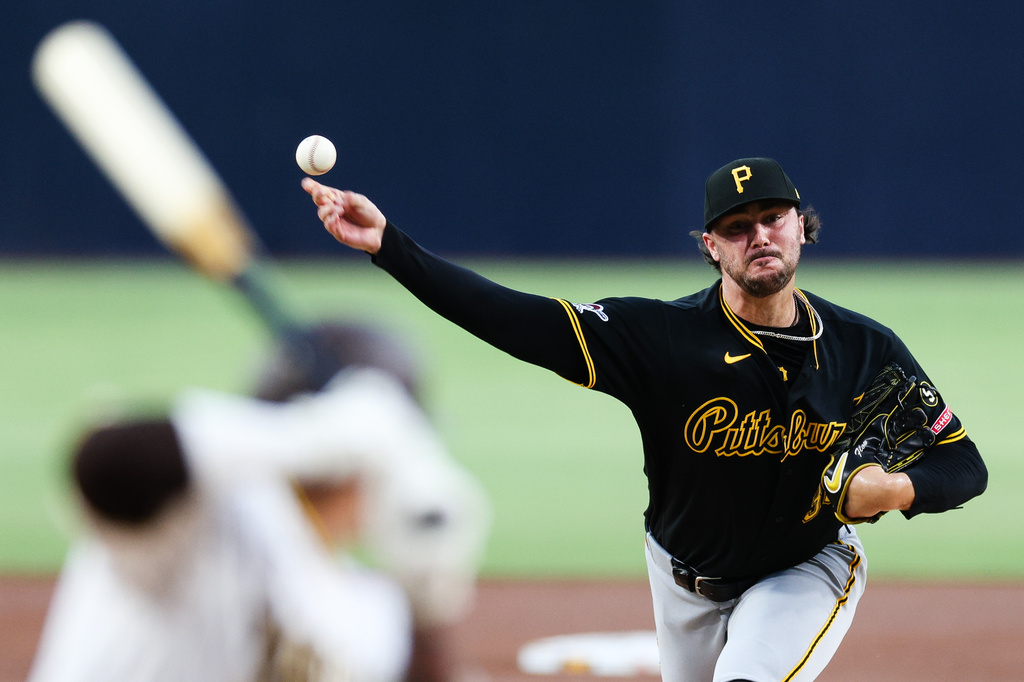 Pittsburgh Pirates' Paul Skenes, right, delivers a pitch to San Diego Padres' Manny Machado in the first inning of a baseball game Tuesday, Aug. 25, 2026, in San Diego. (AP Photo/Derrick Tuskan)