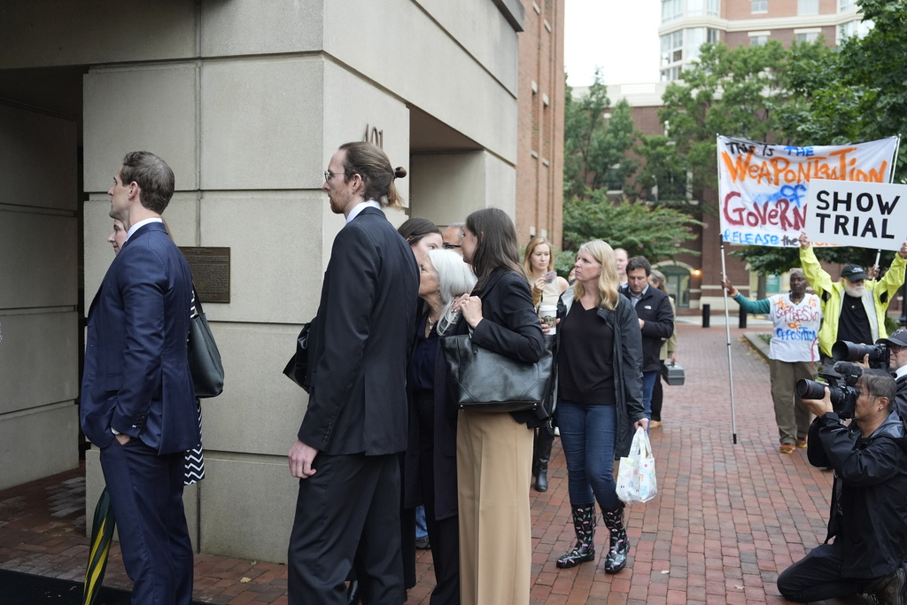 Family of former FBI Director James Comey and others, arrive at federal court in Alexandria, Va., Wednesday, Oct. 8, 2025. (AP Photo/Alex Brandon)