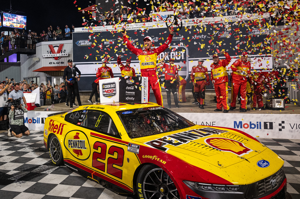 Team Penske driver Joey Logano (22) celebrates in victory lane after winning the Cook Out 400 at Richmond Raceway, Saturday, Aug. 15, 2026, in Richmond Va. (AP Photo/Robert Simmons)