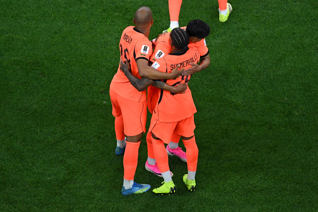 Netherlands' Crysencio Summerville (24) is congratulated by teammates after scoring a goal during the World Cup Group F soccer match between the Netherlands and Japan in Arlington, Texas, near Dallas, Sunday, June 14, 2026. (AP Photo/Jessica Tobias)