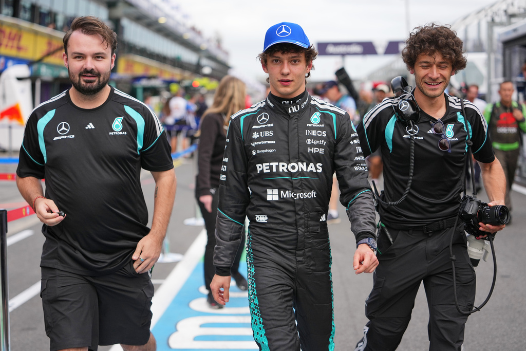 Mercedes driver Andrea Kimi Antonelli of Italy walks down pit lane with teammates following the qualifying session for the Australian Formula One Grand Prix at Albert Park, in Melbourne, Australia, Saturday, March 7, 2026. (AP Photo/Asanka Brendon Ratnayake)