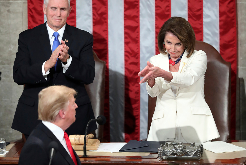 FILE - President Donald Trump turns to House speaker Nancy Pelosi of Calif., as he delivers his State of the Union address to a joint session of Congress on Capitol Hill in Washington, as Vice President Mike Pence watches, Feb. 5, 2019. (AP Photo/Andrew Harnik File)