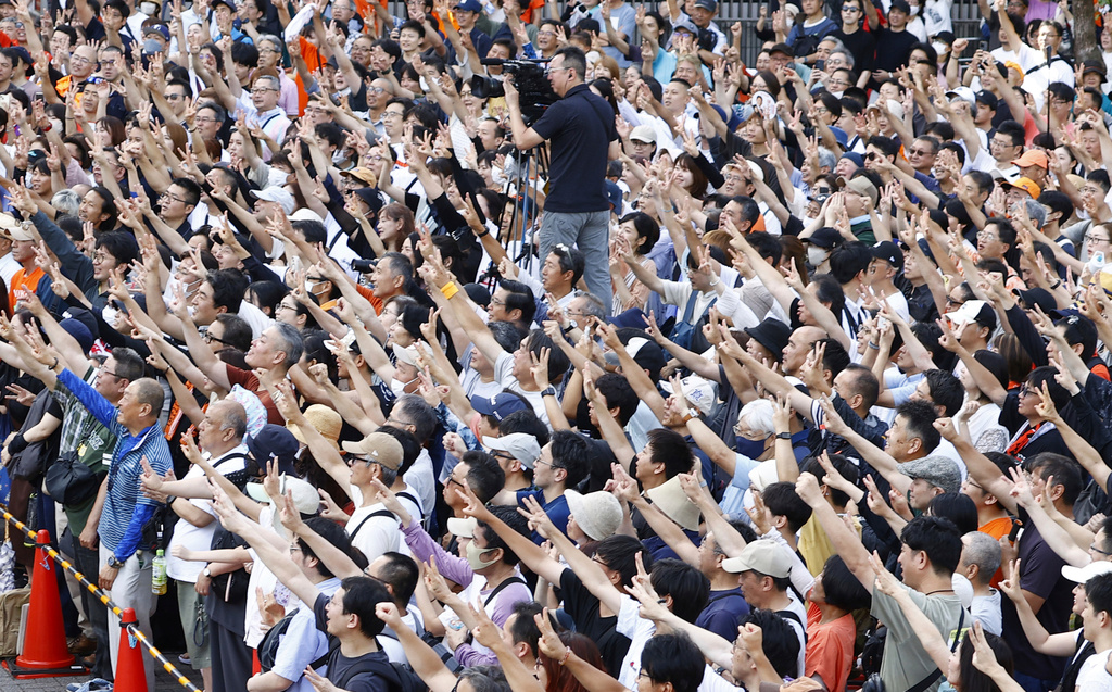 FILE- People gather during an election campaign of Sanseito party for the upper house election in Yokohama, July 19, 2025. (Kyodo News via AP, File)