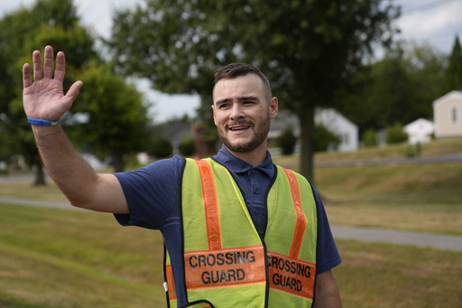 Crossing guard Travis Callis works outside Martinsburg North Middle School in Martinsburg, W.Va., on Sept. 5, 2025. (AP Photo/River Zhang) Crossing guard Travis Callis works outside Martinsburg North Middle School in Martinsburg, W.Va., on Sept. 5, 2025. (AP Photo/River Zhang)