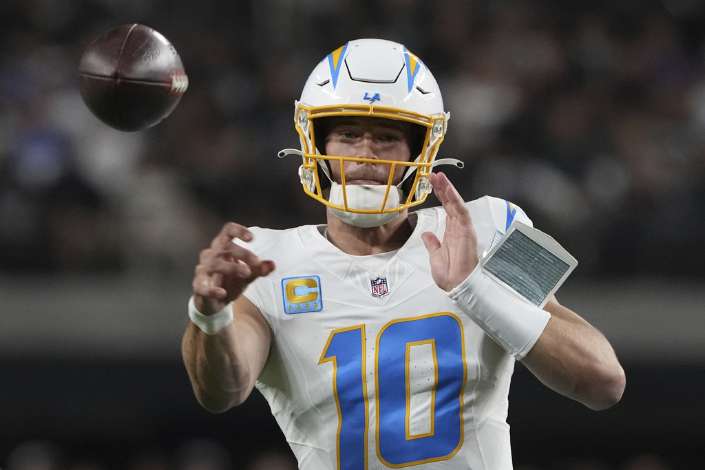 Los Angeles Chargers quarterback Justin Herbert (10) throws against the Las Vegas Raiders during the first half of an NFL football game, Monday, Sept. 15, 2025, in Las Vegas. (AP Photo/Rick Scuteri)