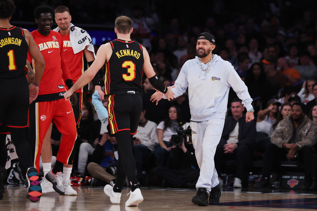 Atlanta Hawks guard Trae Young, right, greets teammate Luke Kennard (3) during the second half of an NBA basketball game against the New York Knicks, Friday, Jan. 2, 2026, in New York. (AP Photo/Heather Khalifa)