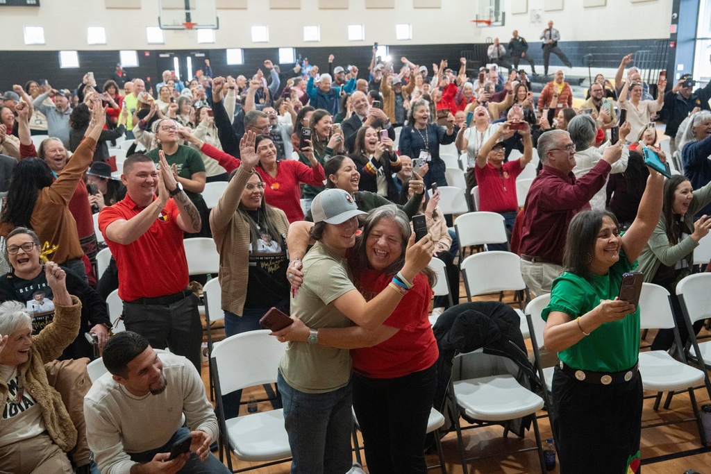 People celebrate after passage of the National Defense Authorization Act by the U.S. Senate during a watch party hosted by the Lumbee Tribe of North Carolina, Wednesday, Dec. 17, 2025, in Pembroke, N.C. (AP Photo/Allison Joyce)