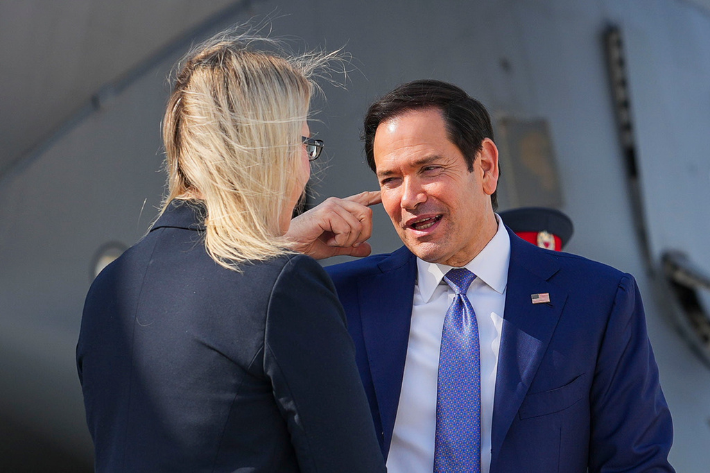 U.S. Secretary of State Marco Rubio, right, speaks with the U.S. Ambassador to Bahrain Stephanie Hallett before boarding a U.S. Air Force C-17 Globemaster III transport aircraft at Bahrain International Airport after his visit to the Middle East, in Manama, Bahrain Thursday, June 25, 2026. (Eric Lee/Pool Photo via AP)