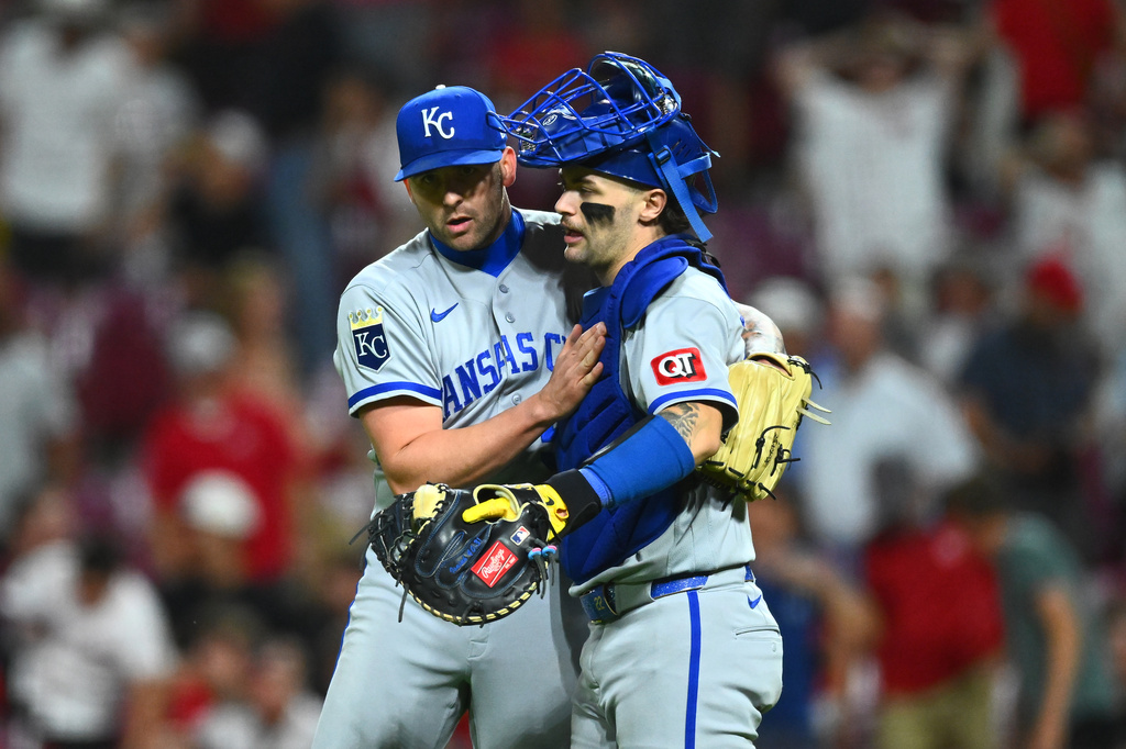 Kansas City Royals pitcher Alex Lange, left, celebrates with catcher Carter Jensen following a baseball game against the Cincinnati Reds in Cincinnati, Wednesday, June 3, 2026. (AP Photo/Ben Jackson)