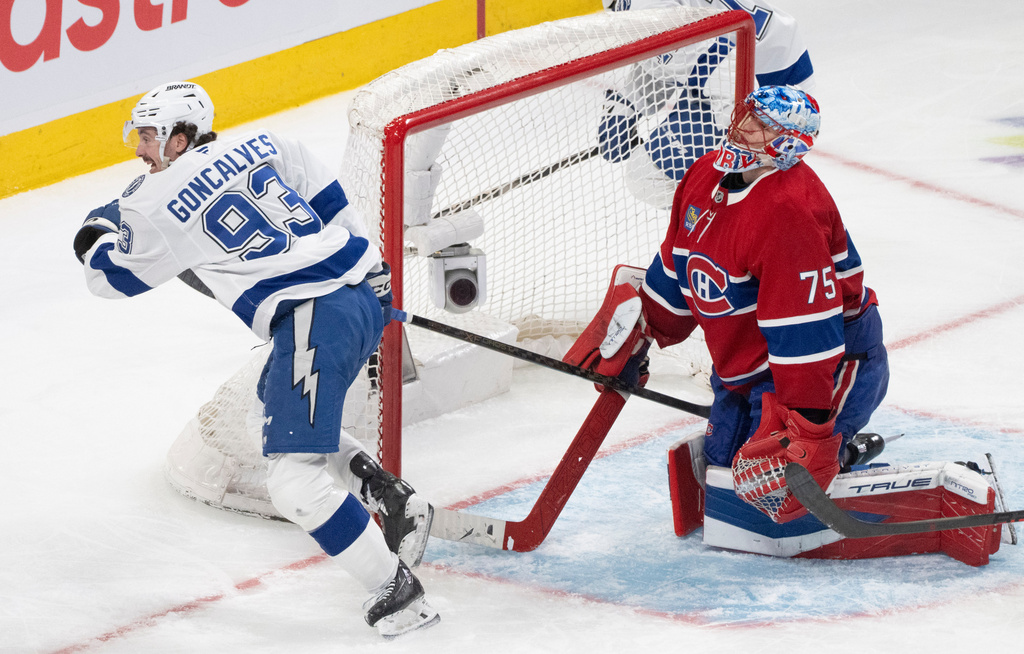 Tampa Bay Lightning's Gage Goncalves (93) celebrates after his goal against Montreal Canadiens goaltender Jakub Dobes (75) during overtime of Game 6 in the first round of an NHL hockey Stanley Cup playoff series in Montreal, Friday, May 1, 2026. (Christinne Muschi/The Canadian Press via AP)