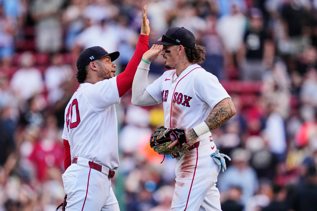 Boston Red Sox's Jarren Duran, right, celebrates with Willson Contreras after they defeated the Baltimore Orioles in the first baseball game of a doubleheader, Wednesday, July 22, 2026, in Boston. (AP Photo/Charles Krupa)