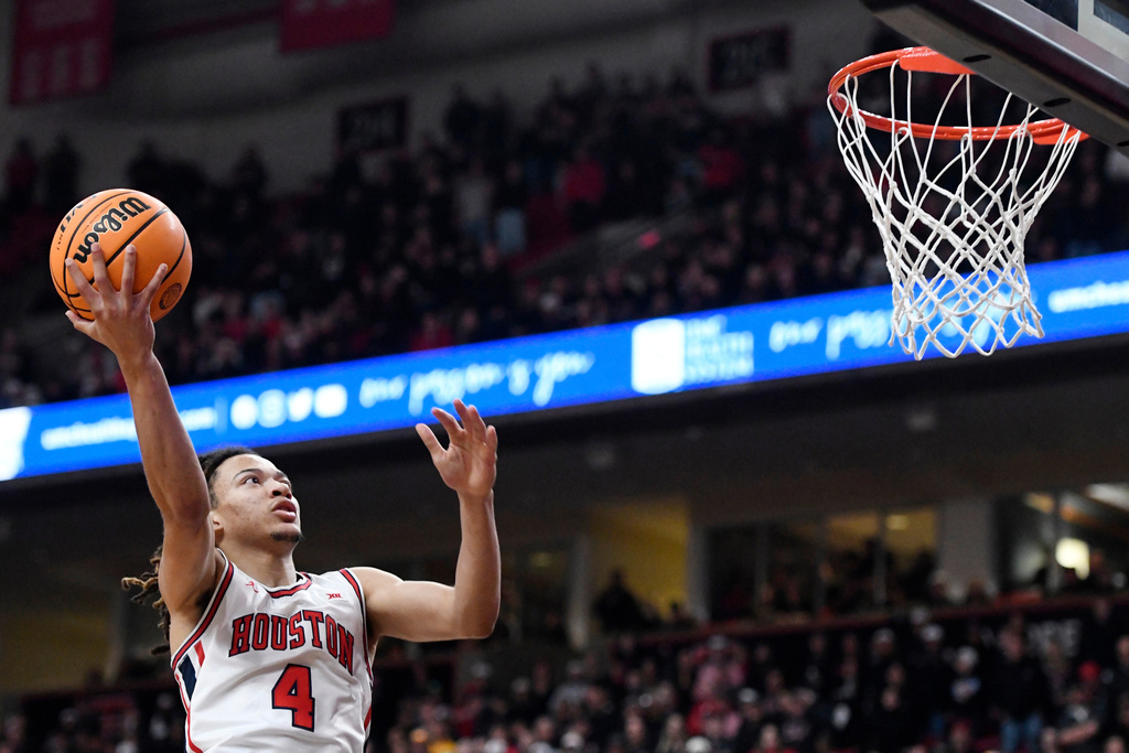 Houston guard Kingston Flemings (4) goes for a layup during the second half in an NCAA college basketball game against Texas Tech, Saturday, Jan. 24, 2026, in Lubbock, Texas. (AP Photo/Annie Rice)