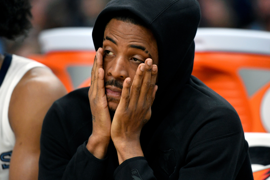 Memphis Grizzlies guard Ja Morant looks on from the bench in the second half of an NBA basketball game against the Phoenix Suns Wednesday, Jan. 7, 2026, in Memphis, Tenn. (AP Photo/Brandon Dill)