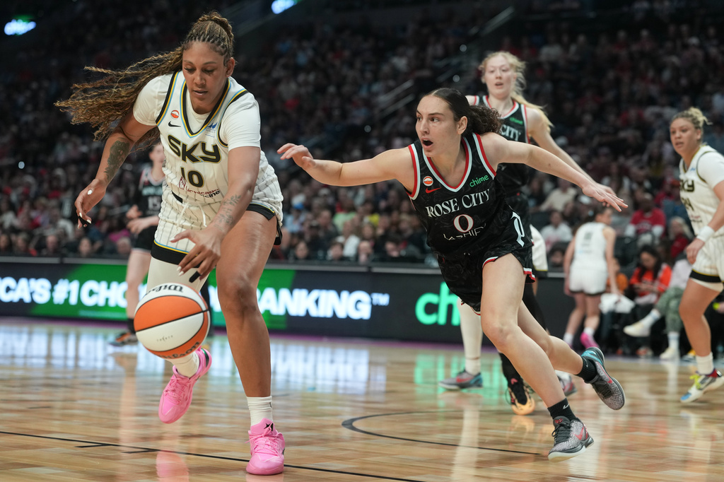 Chicago Sky center Kamilla Cardoso (10) and Portland Fire guard Carla Leite (0) go fore the ball during the first half of a WNBA basketball game on Saturday, May 9, 2026, in Portland, Ore. (AP Photo/Jenny Kane)