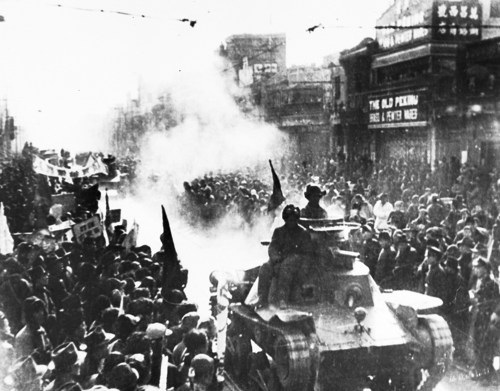 FILE - In this May 2, 1949 file photo, a column of Chinese Communist light tanks enter the streets of Peking, which are filled with people watching the conquerors pass with Chiang Kai-shek's Nationalists losing the Chinese civil war to Mao Zedong's Communists and retreating from the Chinese mainland to the island of Taiwan. (AP Photo, File)