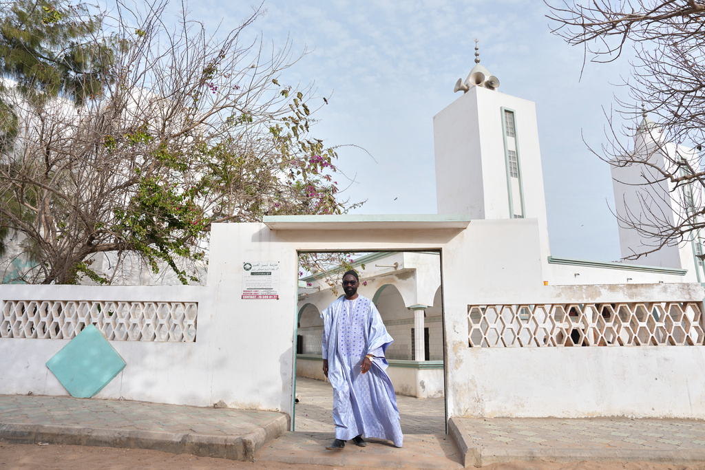 Ababacar Mboup, an activist against homosexuality and founder of And Samm Jikko Yi or "Together for the Preservation of Values," walks out of a mosque in Guediawaye, Senegal, Sunday, March 8, 2026. (AP Photo/Misper Apawu)