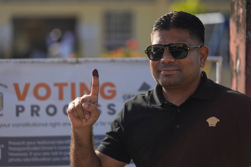 FILE - Presidential candidate Azruddin Mohamed of the We Invest in Nationhood party displays his ink-stained finger after voting in general elections in Georgetown, Guyana, Sept. 1, 2025. (AP Photo/Matias Delacroix, File) FILE - Presidential candidate Azruddin Mohamed of the We Invest in Nationhood party displays his ink-stained finger after voting in general elections in Georgetown, Guyana, Sept. 1, 2025. (AP Photo/Matias Delacroix, File)