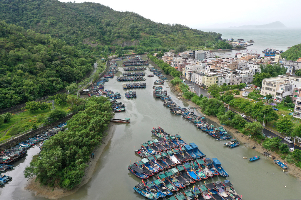 In this photo released by Xinhua News Agency, a drone photo shows fishing boats taking shelter ahead of Typhoon Noul at a port in Shenzhen-Shanwei Special Cooperation Zone in southern China's Guangdong Province on Saturday, July 25, 2026. (Lu Hanxin/Xinhua via AP)