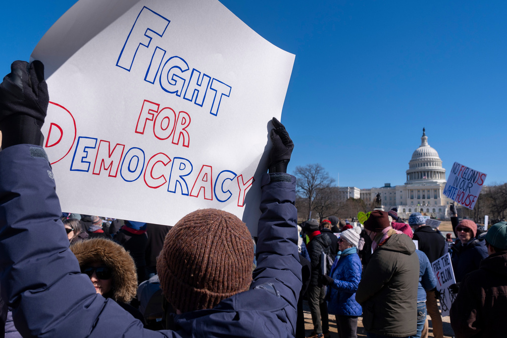 FILE - People protest as part of the "No Kings Day" protest on Presidents Day in Washington, Monday, Feb. 17, 2025, near the Capitol in Washington. (AP Photo/Jacquelyn Martin, File)
