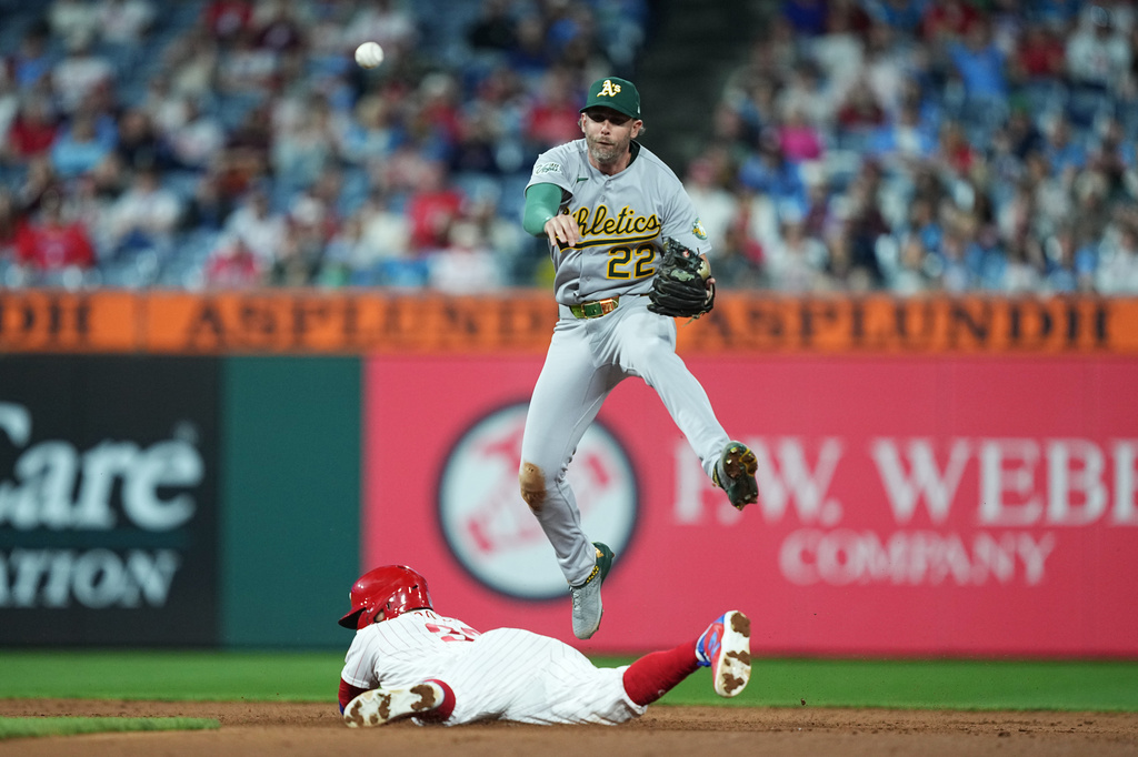 Philadelphia Phillies' Edmundo Sosa is out at second as Athletics second baseman Jeff McNeil attempts a double play during the sixth inning of a baseball game, Wednesday, May 6, 2026, in Philadelphia. (AP Photo/Matt Rourke)