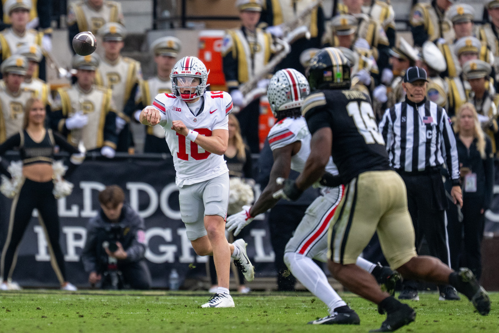 Ohio State quarterback Julian Sayin (10) throws a pass during the second half of an NCAA college football game against Purdue, Saturday, Nov. 8, 2025, in West Lafayette, Ind. (AP Photo/Doug McSchooler)