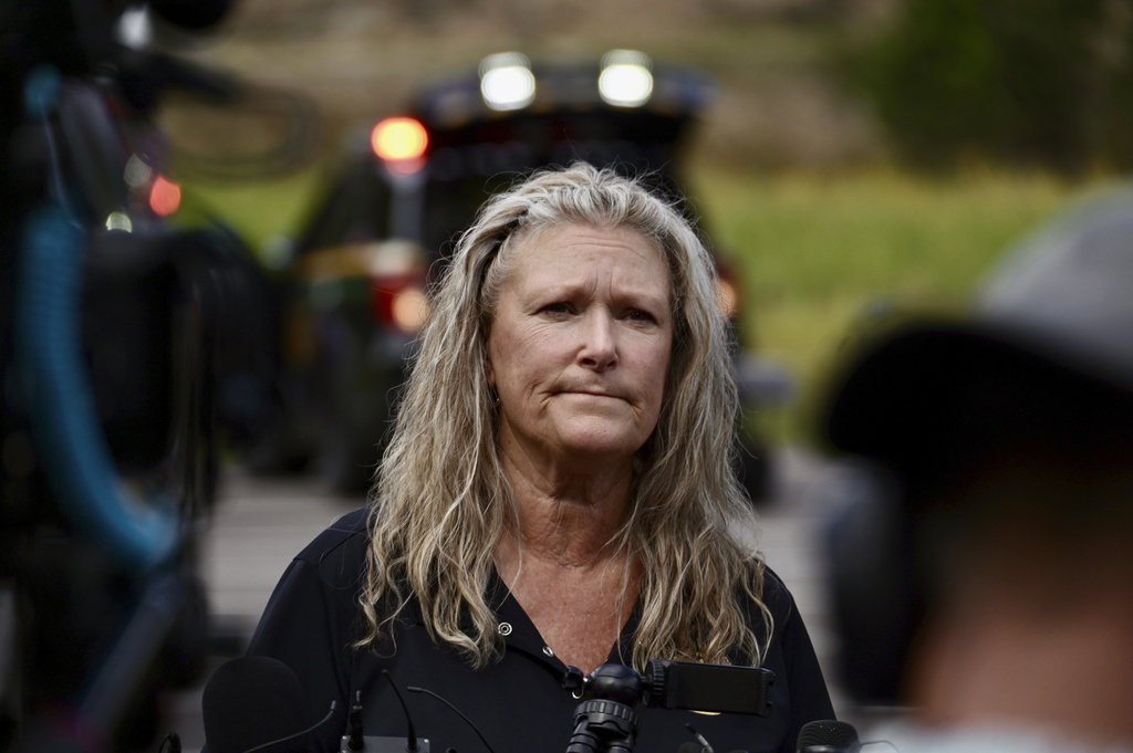 Jefferson County, Colo., Sheriffs Department spokesperson Jacki Kelley waits to speak with members of the media after a shooting at Evergreen High School Wednesday, Sept. 10, 2025, in Evergreen,Colo. (Hyoung Chang/The Denver Post via AP)