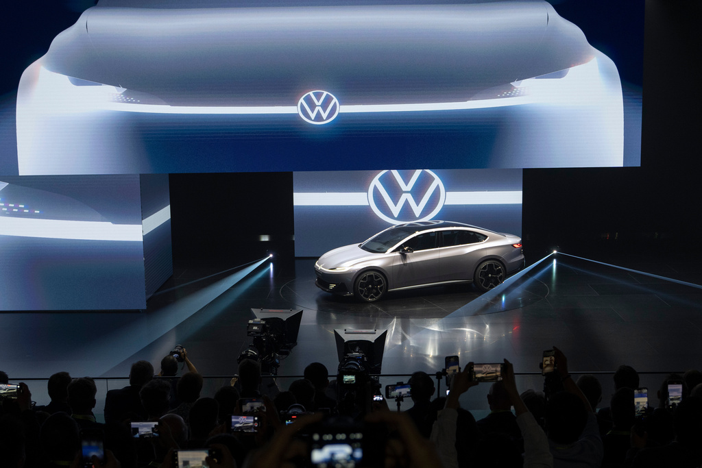 Attendees look at the ID.AURA concept car during the Volkswagen Group media night ahead of the Auto Show in Shanghai, April 22, 2025. (AP Photo/Ng Han Guan)
