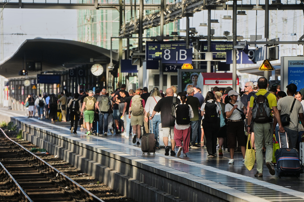 Passengers wait for a train at a platform in the central train station in Frankfurt, Germany, Wednesday, June 24, 2026, following the nationwide service disruption on the Deutsche Bahn network. (AP Photo/Michael Probst)