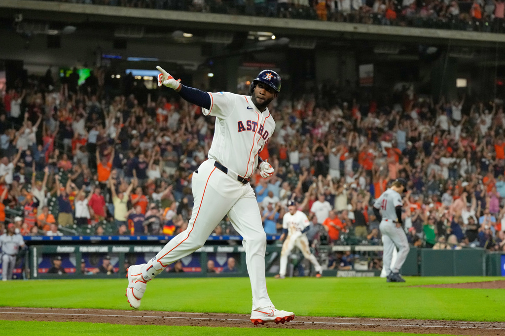 Houston Astros' Yordan Alvarez celebrates after hitting a grand slam against the Minnesota Twins during the fourth inning of a baseball game Tuesday, June 30, 2026, in Houston. (AP Photo/David J. Phillip)