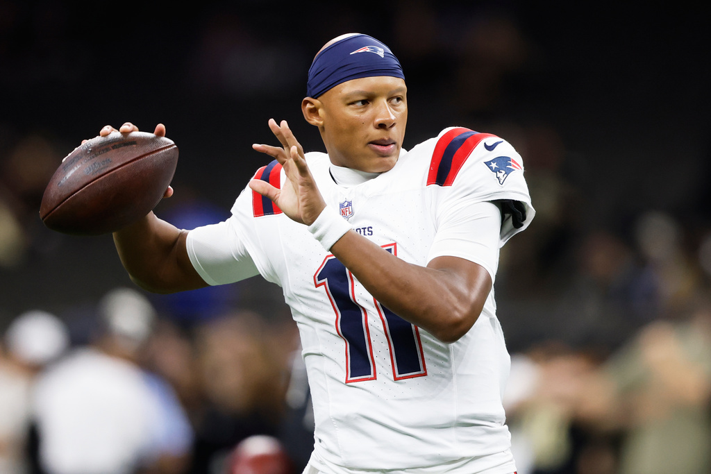 FILE - New England Patriots quarterback Josh Dobbs warms up before an NFL football game against the New Orleans Saints, Sunday, Oct. 12, 2025, in New Orleans. (AP Photo/Butch Dill,File)