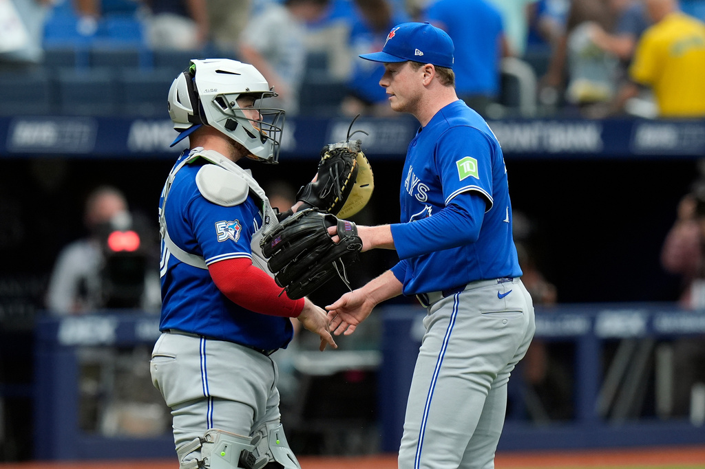 Toronto Blue Jays pitcher Louis Varland, right, celebrates with catcher Alejandro Kirk after closing out the Tampa Bay Rays during the ninth inning of a baseball game Thursday, Aug. 20, 2026, in St. Petersburg, Fla. (AP Photo/Chris O'Meara)