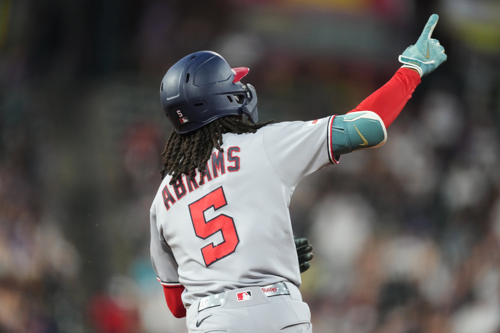 Washington Nationals' CJ Abrams gestures to the bullpen as he circles the bases after hitting a two-run home run off Colorado Rockies relief pitcher Antonio Senzatela in the seventh inning of a baseball game Monday, July 20, 2026, in Denver. (AP Photo/David Zalubowski)