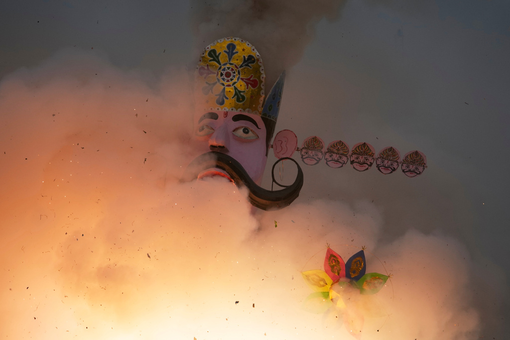 An effigy of mythical demon king Ravana goes up in flames marking the end of Dussehra festival in Jammu, India, Thursday, Oct.2, 2025.(AP Photo/Channi Anand)