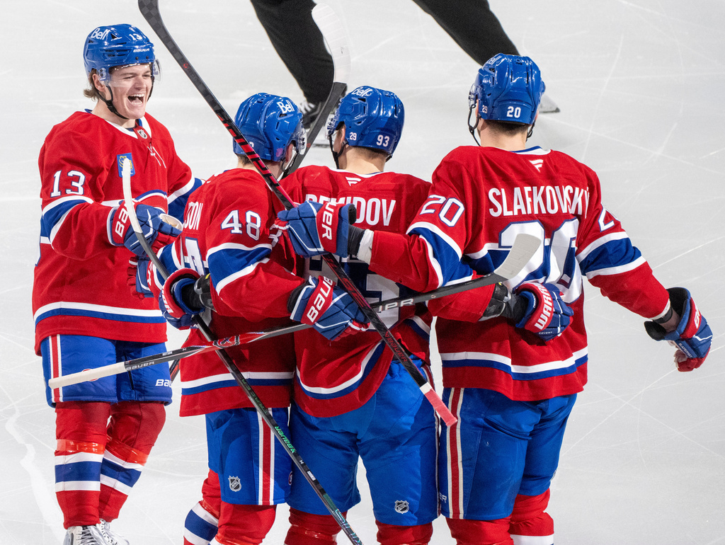 Montreal Canadiens' Ivan Demidov (93) celebrates his goal over the Florida Panthers with teammates Cole Caufield (13), Lane Hutson (48) and Juraj Slafkovsky (20) during the second period of an NHL hockey game in Montreal on Tuesday, April 7, 2026. (Christinne Muschi/The Canadian Press via AP)