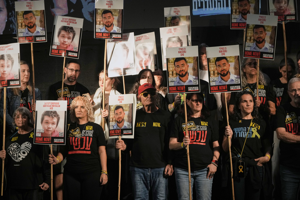 People attend a rally calling for the return of the deceased hostages who are held by Hamas in the Gaza Strip, in Tel Aviv, Israel, Saturday, Nov. 29, 2025. (AP Photo/Mahmoud Illean)