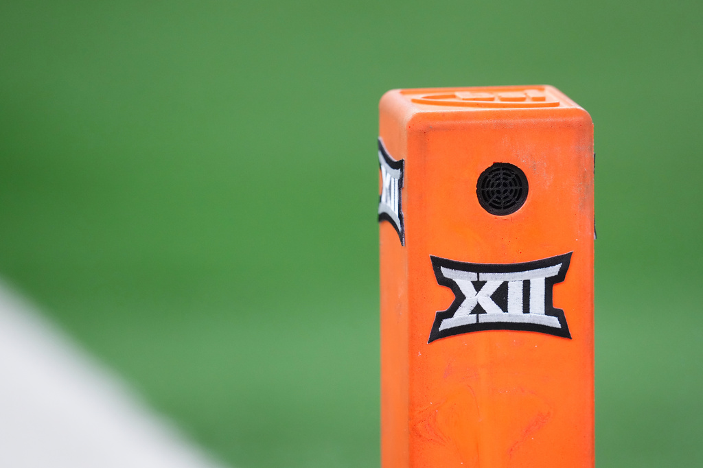 FILE - A pylon sports the Big XII logo during the Big 12 Conference championship NCAA college football game between Texas Tech and BYU Saturday, Dec. 6, 2025, in Arlington, Texas. (AP Photo/Julio Cortez, File)