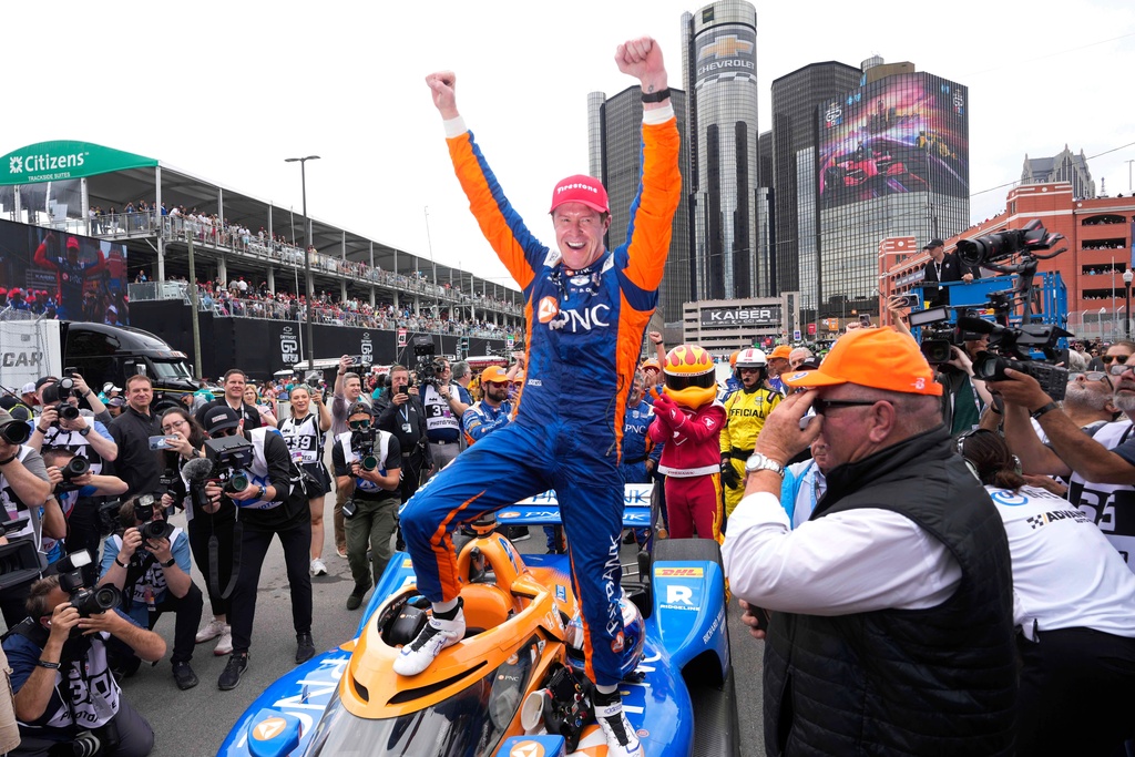 FILE - Scott Dixon celebrates winning the IndyCar Detroit Grand Prix auto race in Detroit, Sunday, June 2, 2024. (AP Photo/Paul Sancya, File)