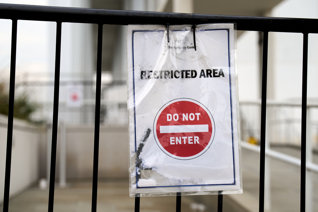 A sign directs people away from behind the Kennedy Center, which has been fenced off and closed to the public, Thursday, Sept. 17, 2026, in Washington. (AP Photo/Jacquelyn Martin)