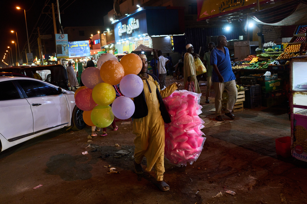 A street vendor sells candy and balloons in Omdurman, on the outskirts of Khartoum, Sudan, Tuesday, April 21, 2026. (AP Photo/Bernat Armangue)