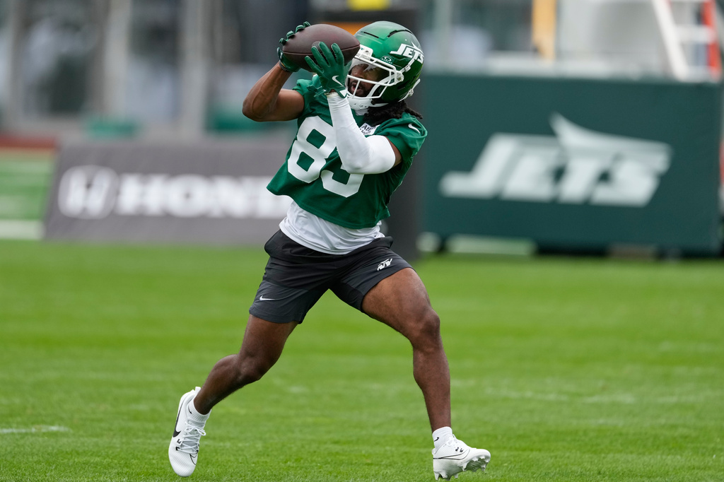 FILE - New York Jets' Omar Cooper Jr. makes a catch during practice at the team's NFL football training camp in Florham Park, N.J., July 30, 2026. (AP Photo/Seth Wenig, File)