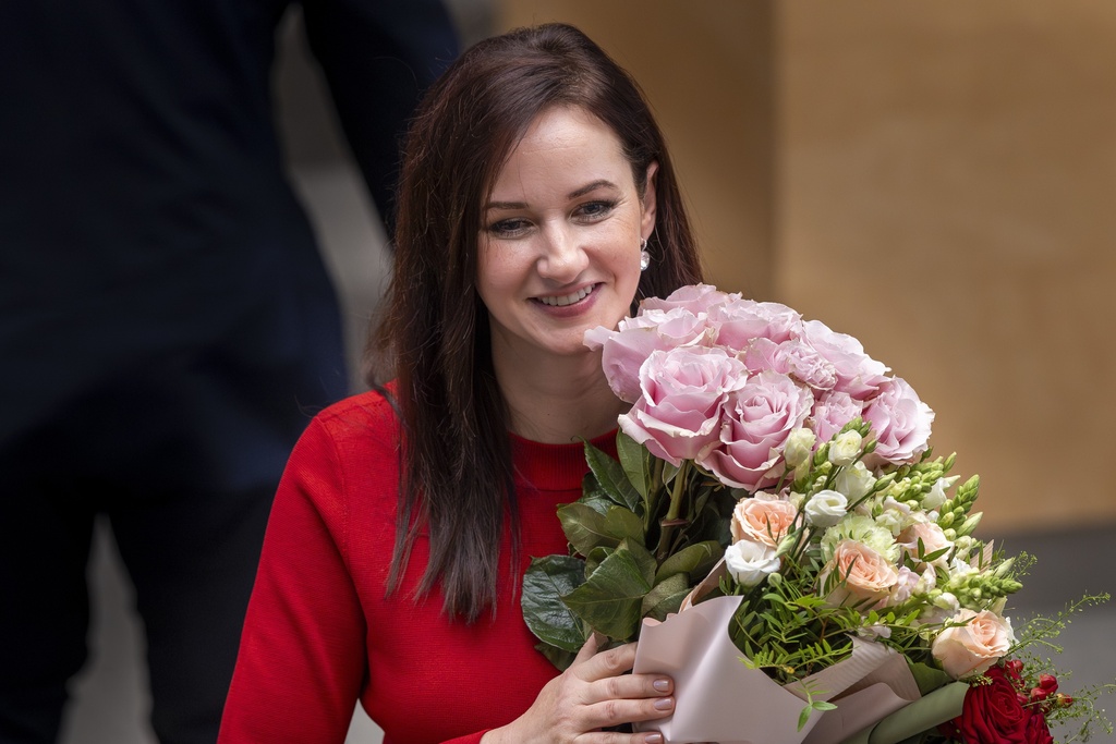 Lithuania's Social Democratic party member Inga Ruginiene smiles at the parliament after Lithuania's parliament approved her as the new Lithuania's Prime Minister, in Vilnius, Lithuania, Tuesday, Aug. 26, 2025. (AP Photo/Mindaugas Kulbis)