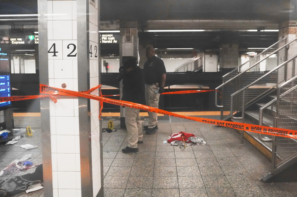 Police investigate the scene after a reported stabbing and shooting at the Grand Central subway station in New York on Saturday, April 11, 2026. (AP Photo/Ryan Murphy)