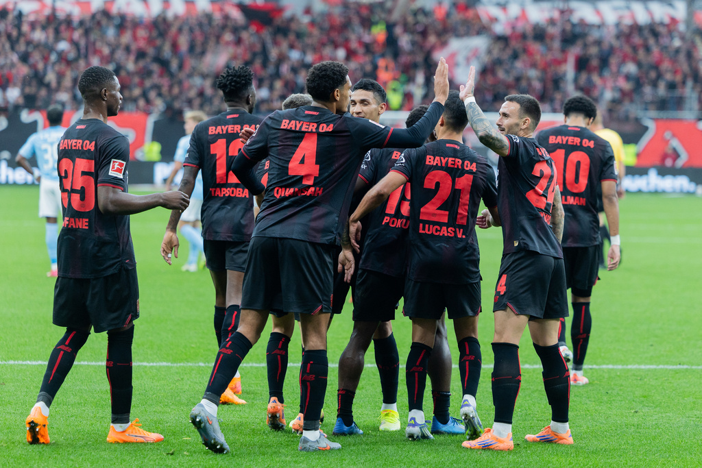 Leverkusen players celebrate Ernest Poku's goal during the Bundesliga soccer match between Bayer Leverkusen and 1. FC Union Berlin at BayArena in Leverkusen, Germany, Saturday Oct. 4, 2025. (Rolf Vennenbernd/dpa via AP)