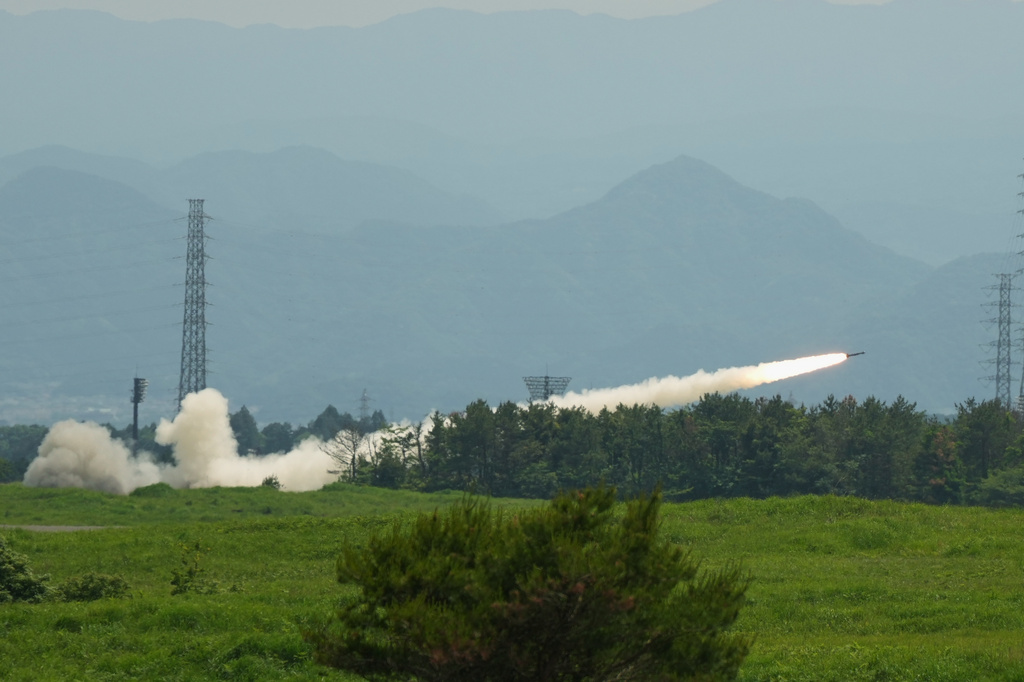 U.S. Marines conduct a live-fire training of the High Mobility Artillery Rocket System, short for HIMARS, at Camp Fuji, in Gotemba, southwest of Tokyo, Wednesday, May 20, 2026. (AP Photo/Hiro Komae)