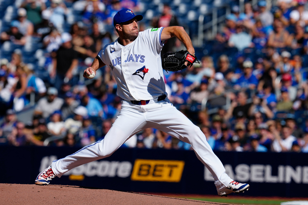 Toronto Blue Jays pitcher Max Scherzer throws against the Cincinnati Reds during the first inning of a baseball game in Toronto, Sunday, Sept. 27, 2026. (Frank Gunn/The Canadian Press via AP)