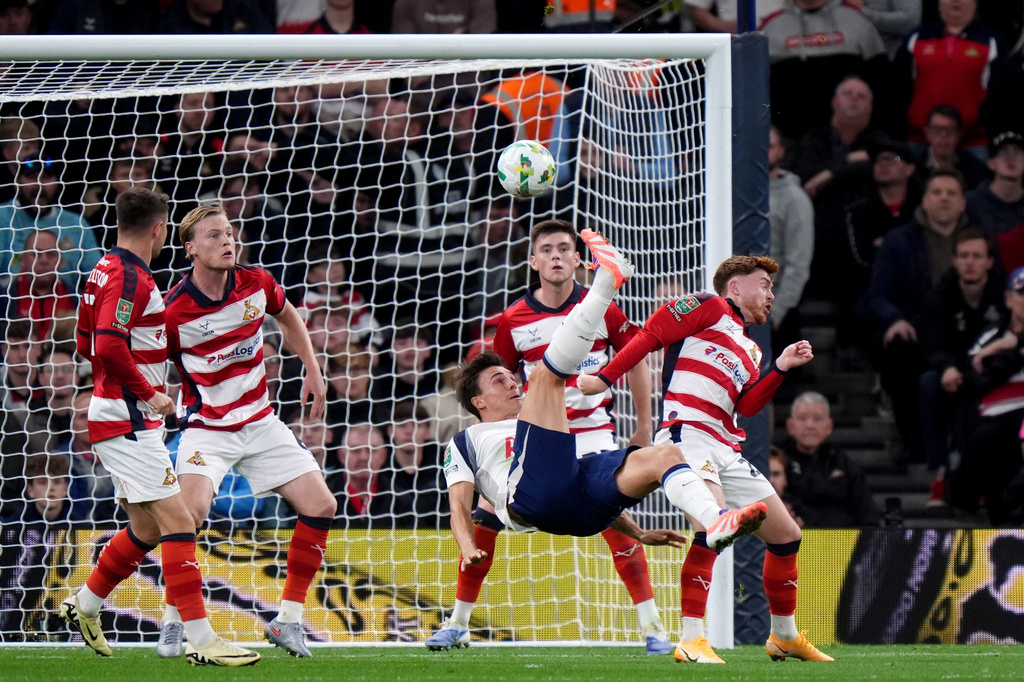 Tottenham Hotspur's Joao Palhinha scores their side's first goal of the game during the English League Cup third round soccer match between Tottenham Hotspur and Doncaster Rovers at the Tottenham Hotspur Stadium, London, Wednesday Sept. 24, 2025. (Bradley Collyer/PA via AP)