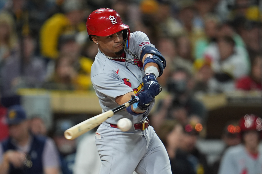 St. Louis Cardinals' Masyn Winn hits an RBI triple during the seventh inning of a baseball game against the San Diego Padres Thursday, May 7, 2026, in San Diego. (AP Photo/Gregory Bull)
